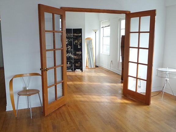 french doors open to 2nd bedroom