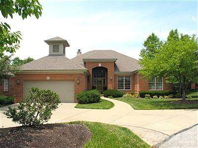 Interesting architectural appointments combine traditional and transitional elements to create a handsome facade.