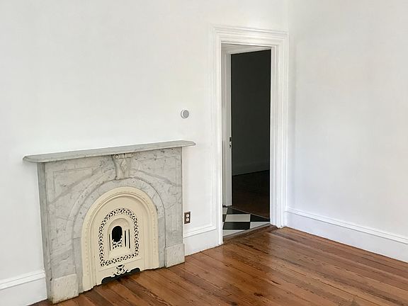 New ceiling fan. Original fireplace to the house (not in use).