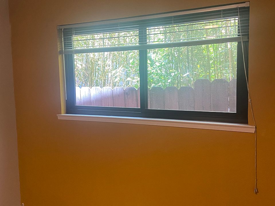 Bedroom wall, showing private view outdoors