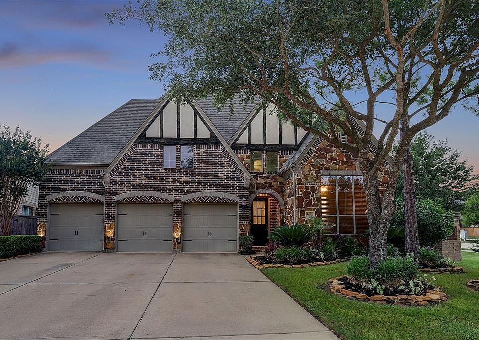 Beautiful corner lot home with three car garage.