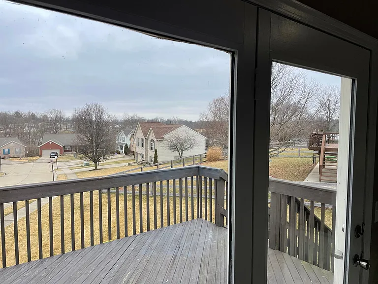 Deck off of dining area. Deck will be restored and stained by owner as soon as weather permits.