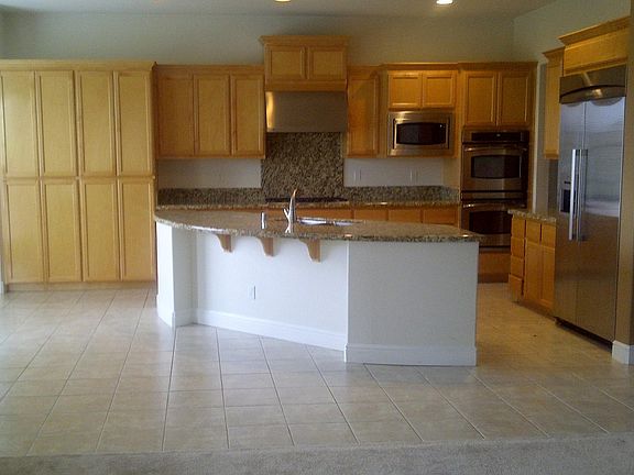 Kitchen with breakfast leading to left side breakfast area