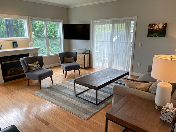 Living room with fireplace and sliders to deck