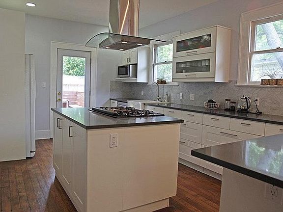 Remodeled kitchen with marble, quartz, and stainless steel