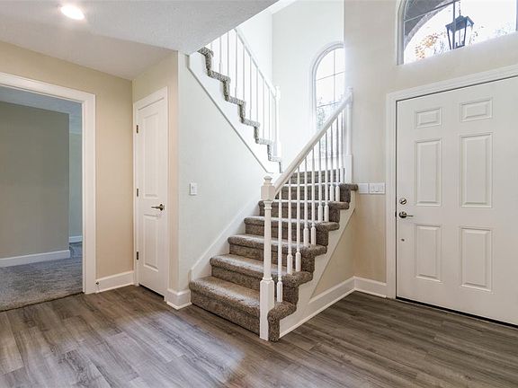 Foyer Area Please note New Paint, Carpeting, Tile, Windows, and Fixtures throughout the Home!