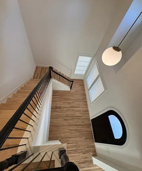 view from upstairs into foyer/entrance