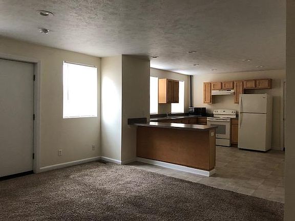 Living room area, door to small deck.