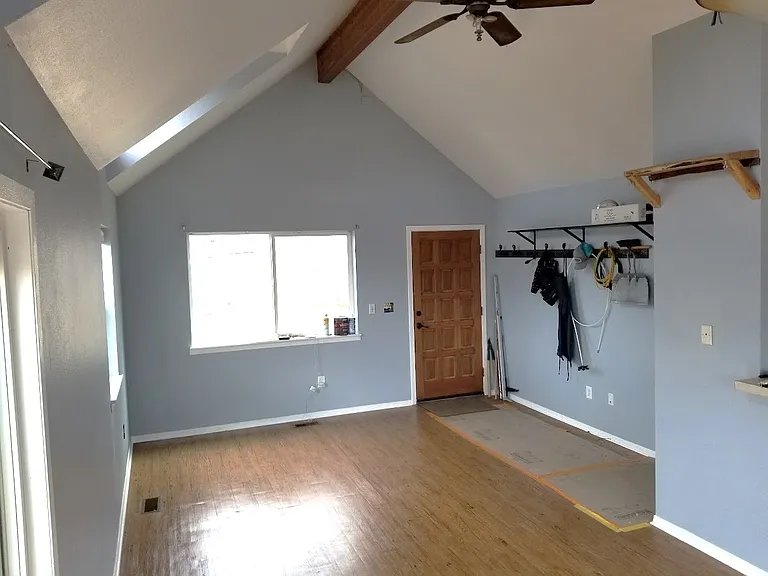 Living area with view of front door.