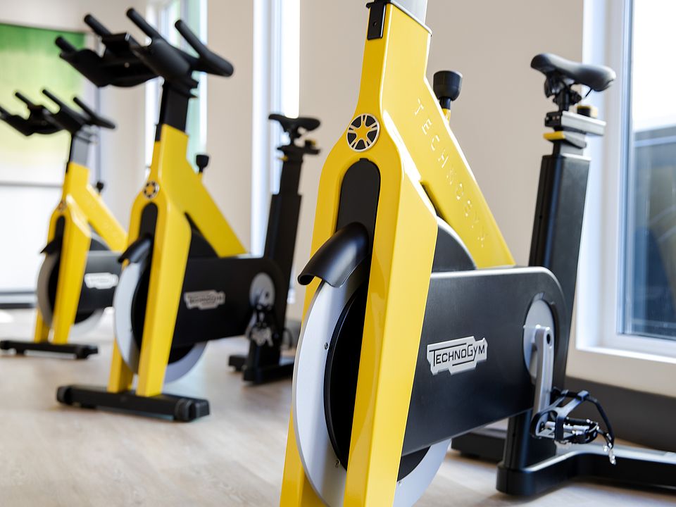 Pedal toward your goals in a vibrant, high-energy spin studio.