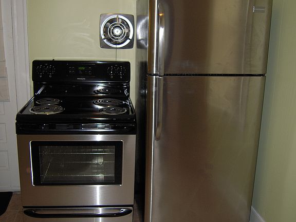 Stainless steel appliances including dishwasher.