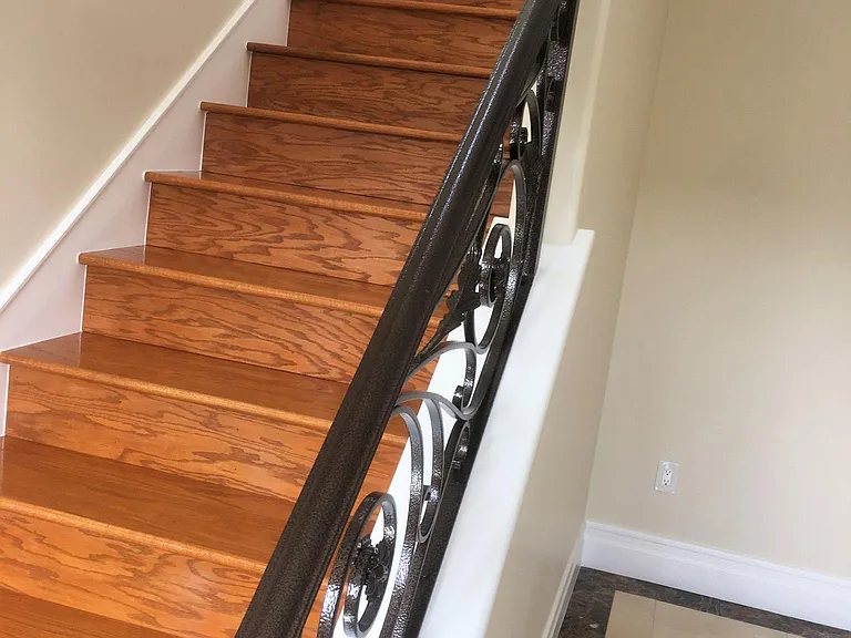 STAIRWELL GOING UPSTAIRS AND BEAUTIFUL RAIL DESIGN. IN ADDITION,NOTICE THE FINISHING DETAILS ON THE MARBLE FLOORING.