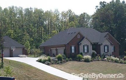 Beautifully landscaped front yard is one of a kind.