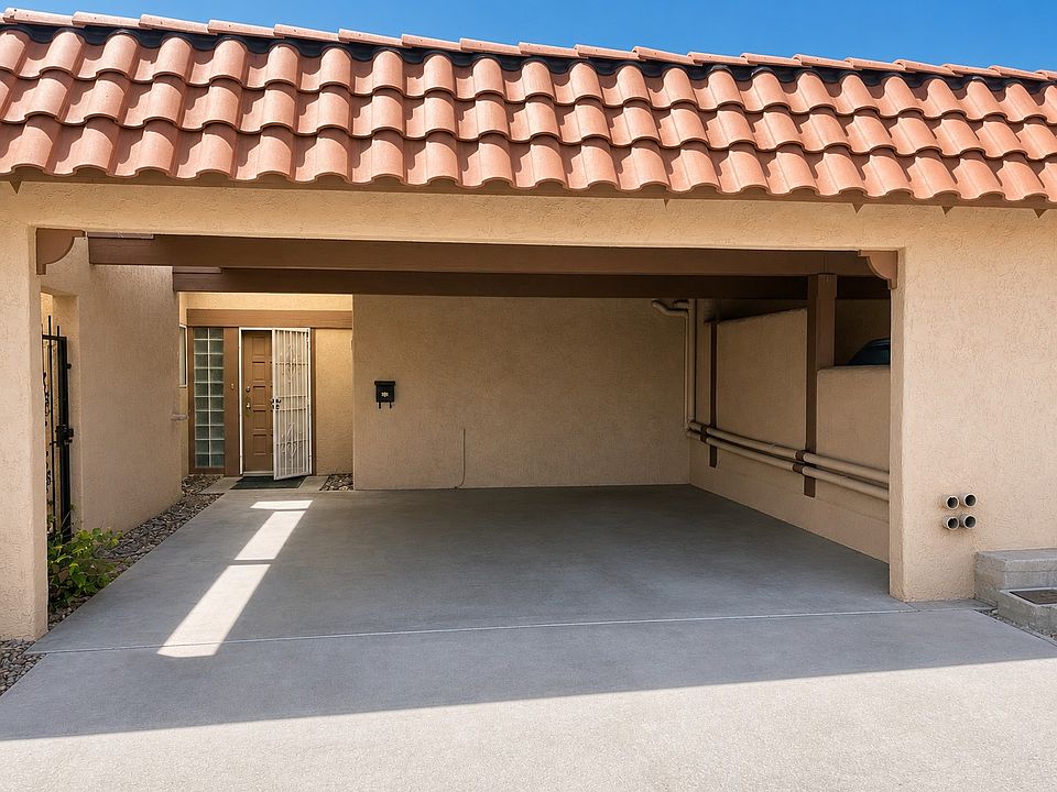 Front exterior (carport + entry)