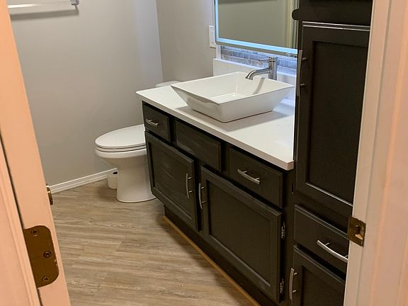 Nicely updated main bath with lots of storage, lighted mirror and new tile