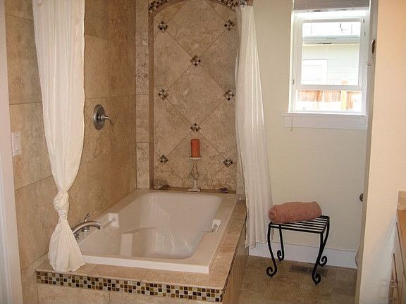 Enjoy the designer shower/ soaker tub for a spa like feeling
