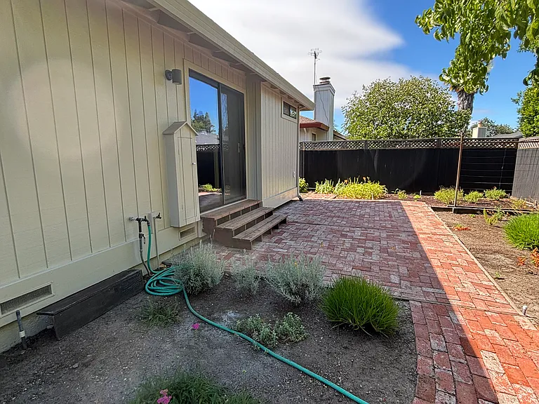 Primary bedroom walks out to backyard