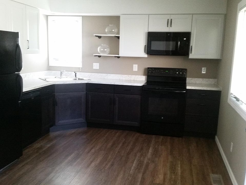 New black and white urban cottage cabinets w/marble look tops