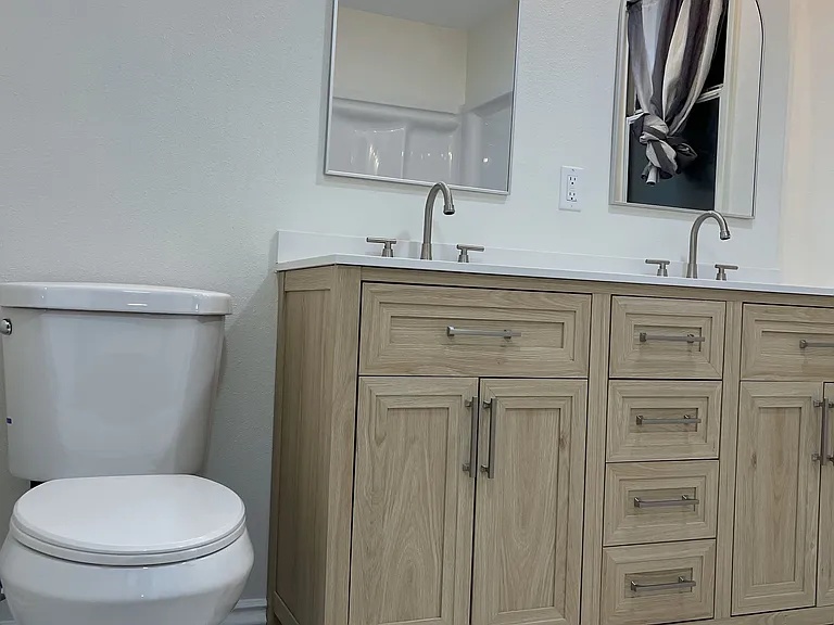 Master bathroom with double sinks and shower
