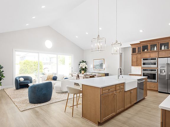 Kitchen overlooking the great room with vaulted ceiling