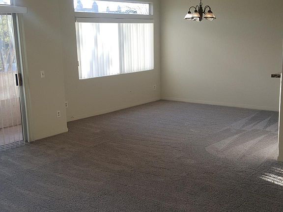 Dining Room large enough for 8 to 10 seating. Setting by west-facing window.