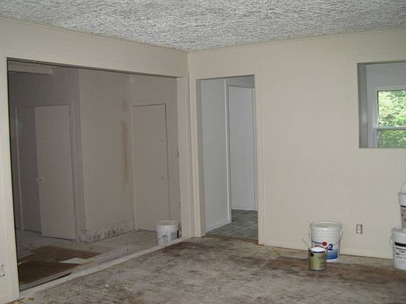 livingroom with pass thru to kitchen and converted garage for media room