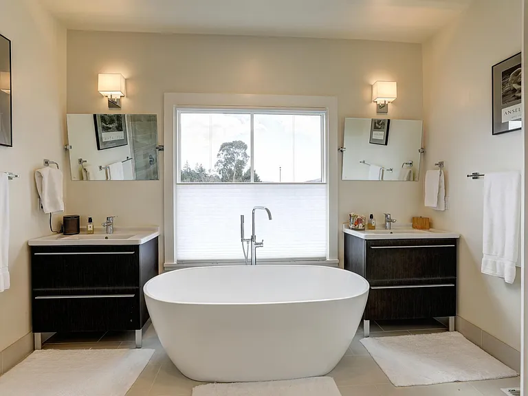 MASTER EN SUITE BATHROOM: SOAKING TUB, LARGE WALK IN SHOWER, DUAL SINKS AND STORAGE.