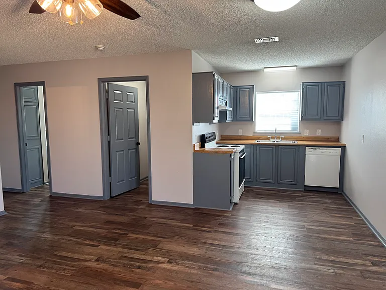 Entrance looking across living and dining to utility room and bath 2.