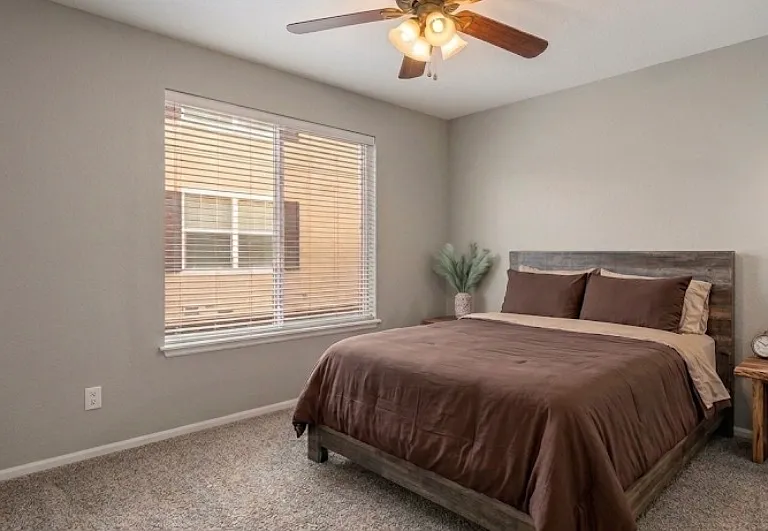 Private bedroom has sliding double door closet