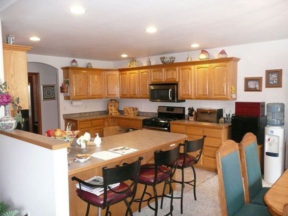 Kitchen- Recent updates include new countertops and SS appliances.