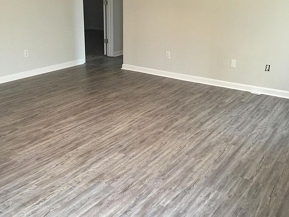 Living room view from front door looking toward master bedroom with full bathroom and bedroom #2.