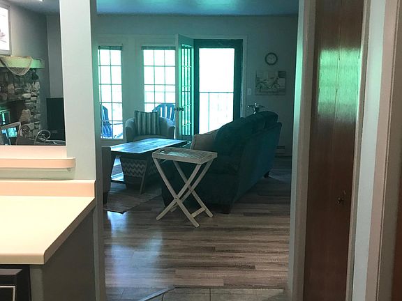 View from front door. Kitchen on the left. A door to the Master Bedroom is on the right.