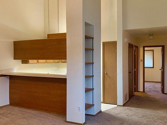 Vaulted ceilings in living area and kitchen.