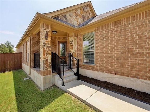 Entry Showing Bricked Landing and Railings