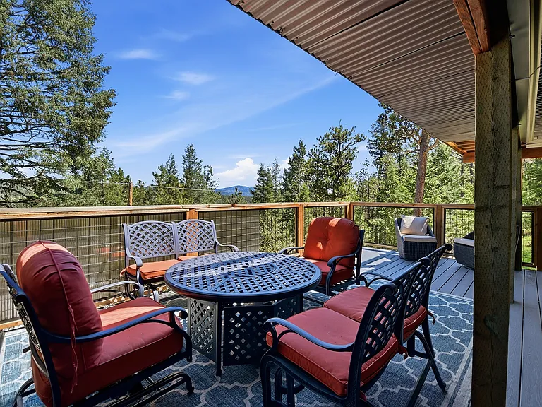 Imagine starting every morning here. Expansive mountain views, mature pines, and complete privacy make this home feel like your own private retreat.