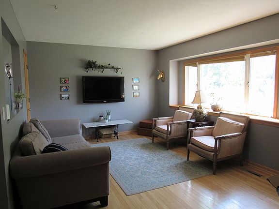 Front room offers hardwood floors, and tons of natural light (couch can stay for free!)