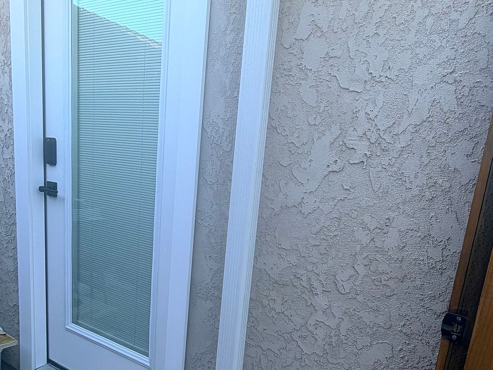 Digital keypad entrance and front door with integrated blinds for light control and privacy