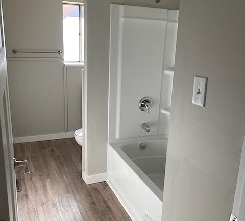 Upstairs bathroom with new shower/tub along with new toilet and vanity!