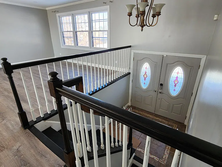Second Floor: Stairs to front door and downstairs.