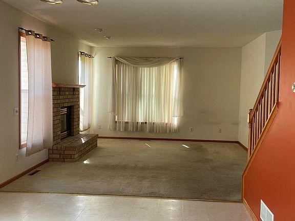 Family room with fireplace. New carpet and paint is being done next week.
(Main foyer and office with french doors not shown)