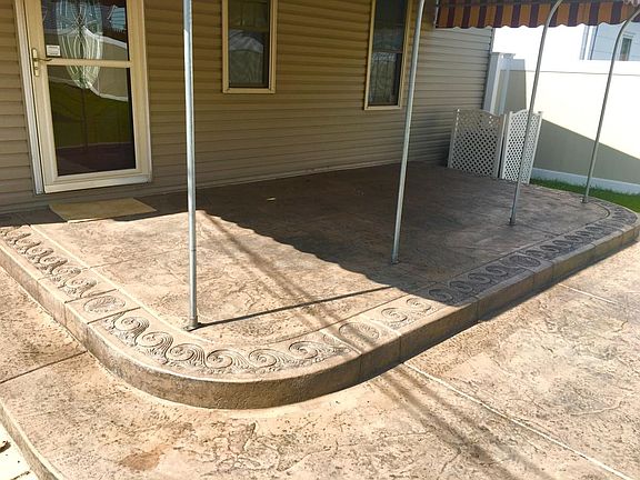 Stamped concrete patio with covered awning