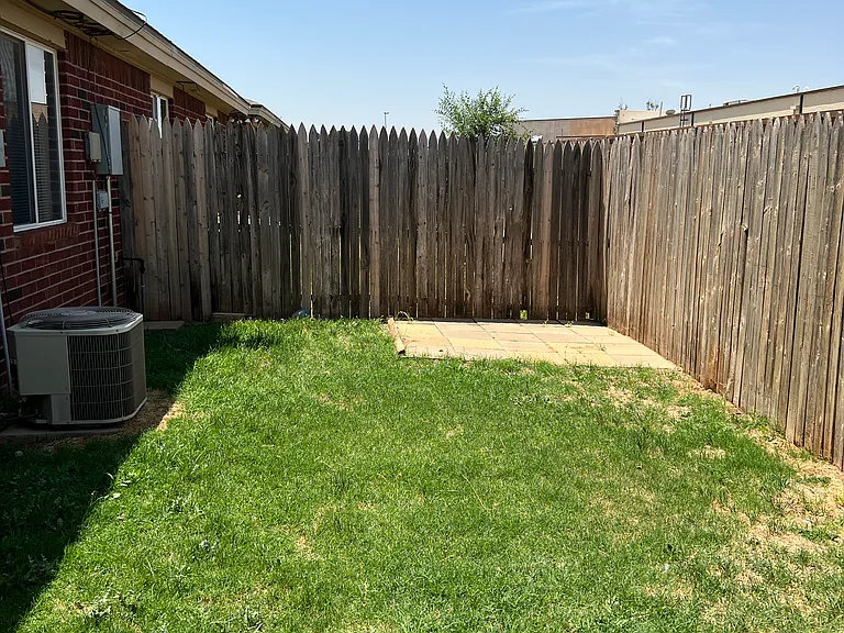 This duplex has a concrete paver pad, perfect if you have a small shed. You won't find this on any other duplex on the block.