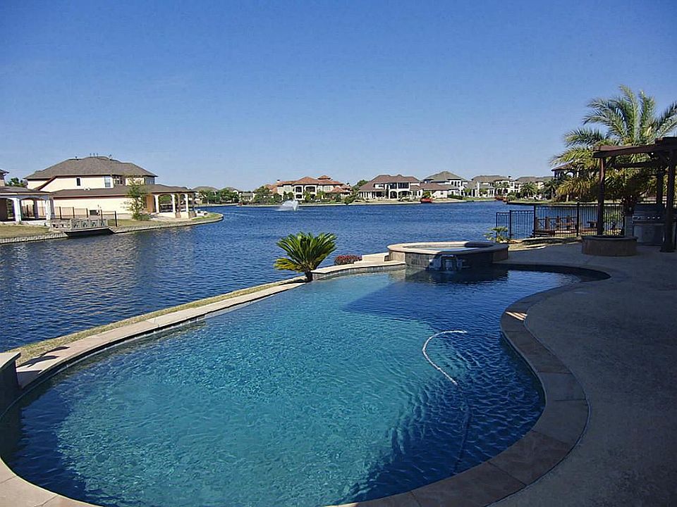 The Ultimate Infinity Edge Pool Visually Overflowing Into Lake Avalon * A Community Connected By Wat