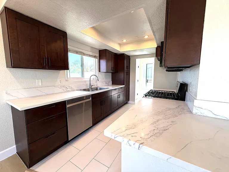Counter for eating with kitchen pantry at the end of the cabinets