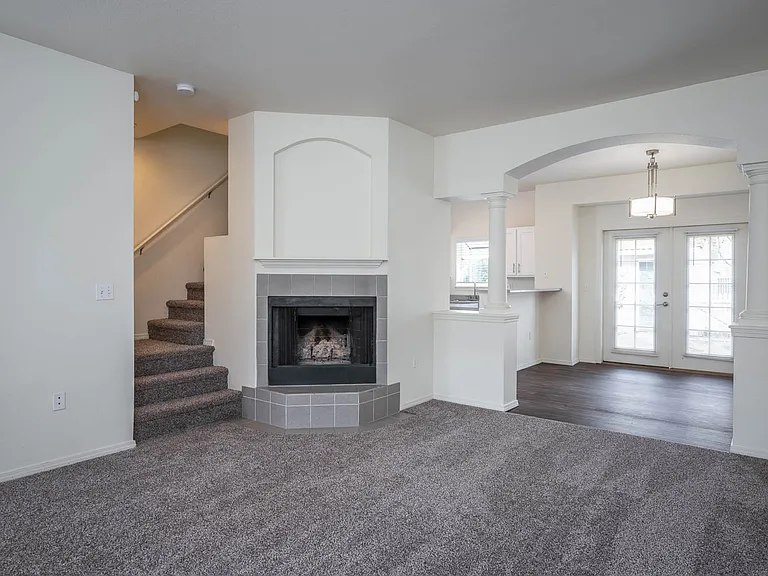 Village at Main Street | 2x2 Spacious Living Room with Corner Fireplace and Dining Room