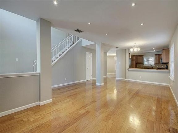 Beautiful floors and neutral palette invite you inside.