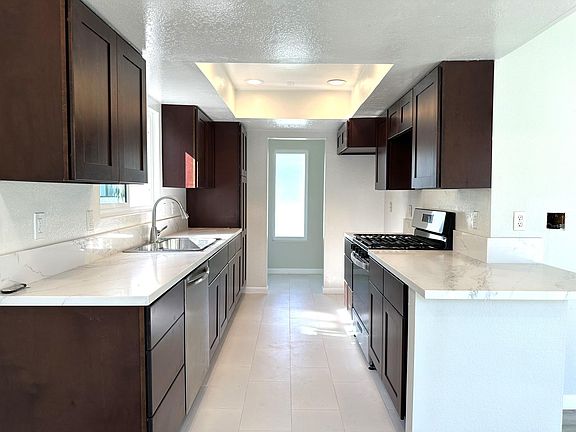 New kitchen with quartz countertop and new appliances