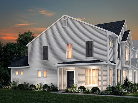 Sharon Exterior 21B features siding, shakes, covered front door and 2-car rear load garage