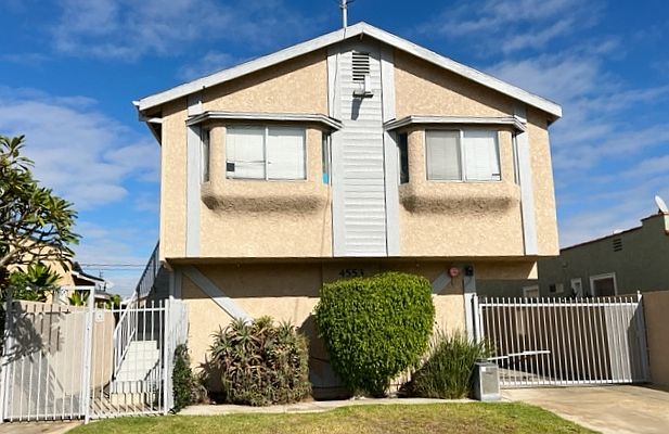 Small 5 unit building. 4 units upstairs with parking below and a studio downstairs