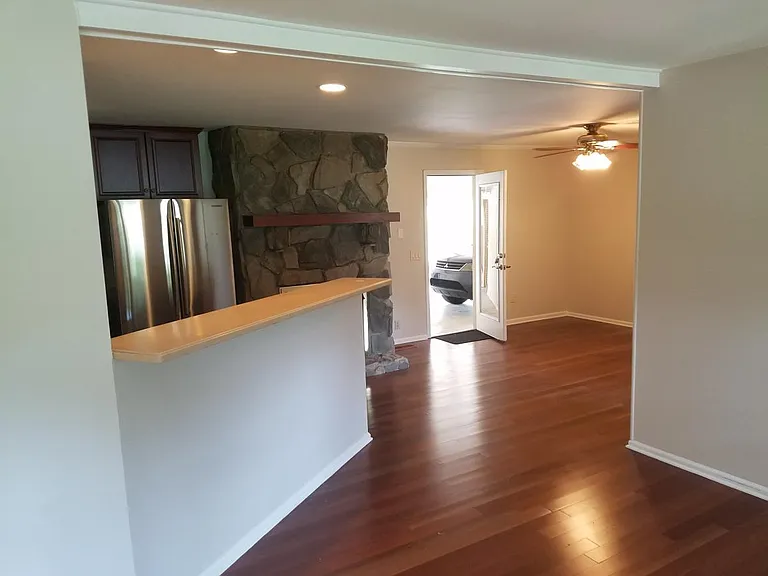 View from livingroom into the kitchen and dining room. Back